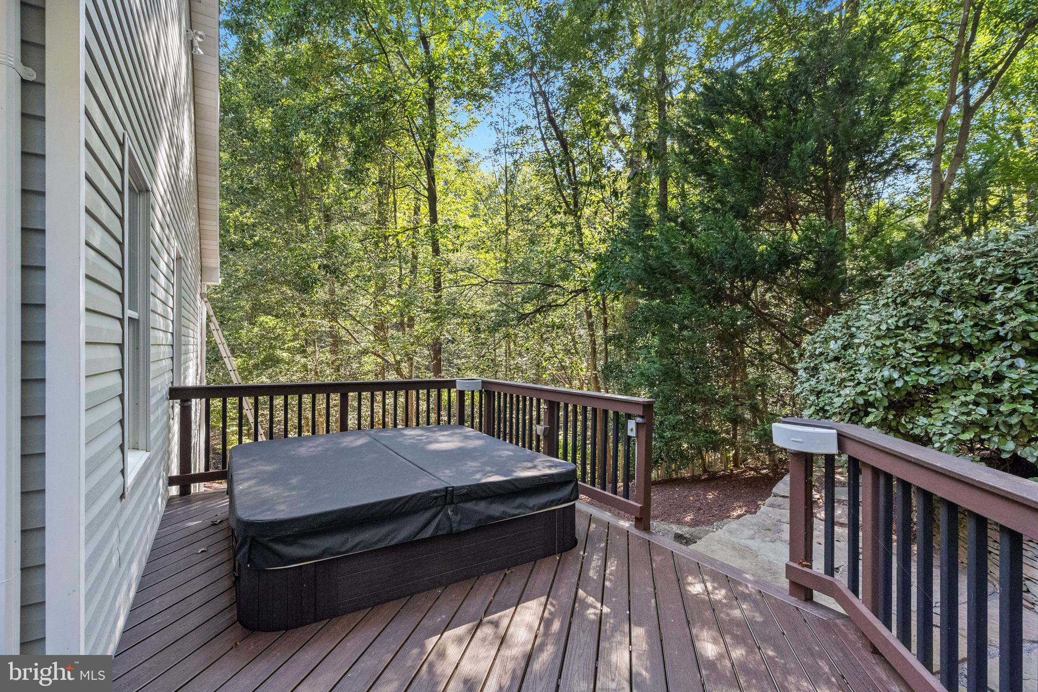 6601 Colchester Road Fairfax Station, VA 22039 - Photo 45 of 78 a view of a wooden deck with a bench