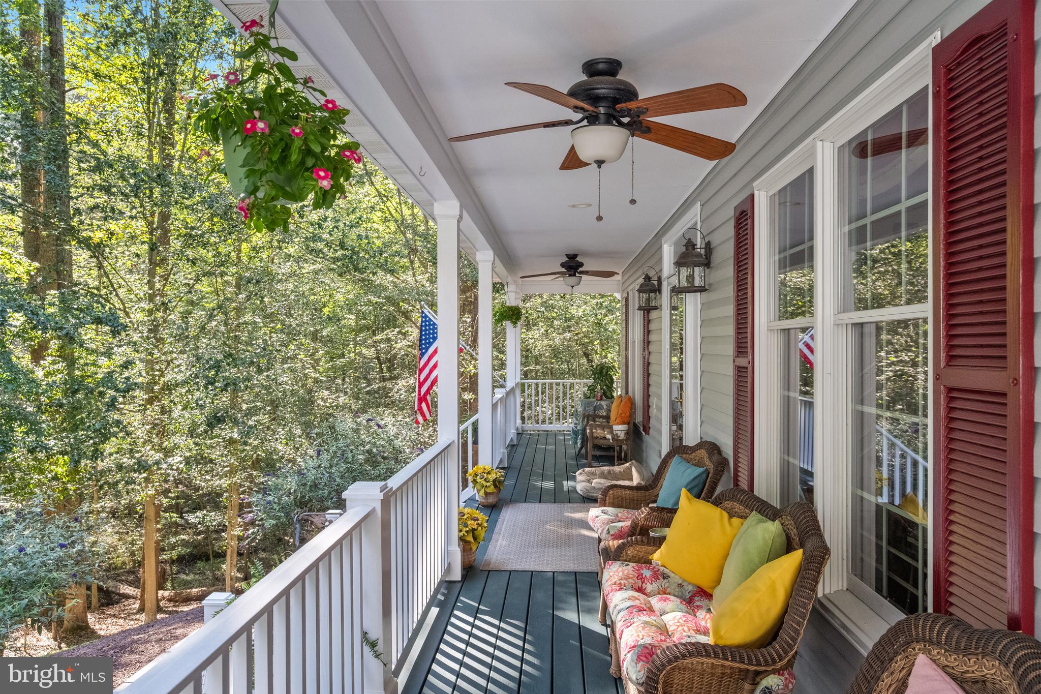 6601 Colchester Road Fairfax Station, VA 22039 - Photo 5 of 78 a view of a porch with furniture and a yard