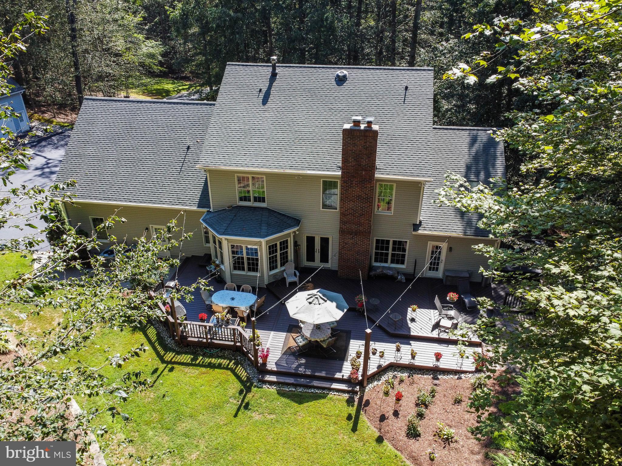 6601 Colchester Road Fairfax Station, VA 22039 - Photo 64 of 78 an aerial view of a house with swimming pool and outdoor seating