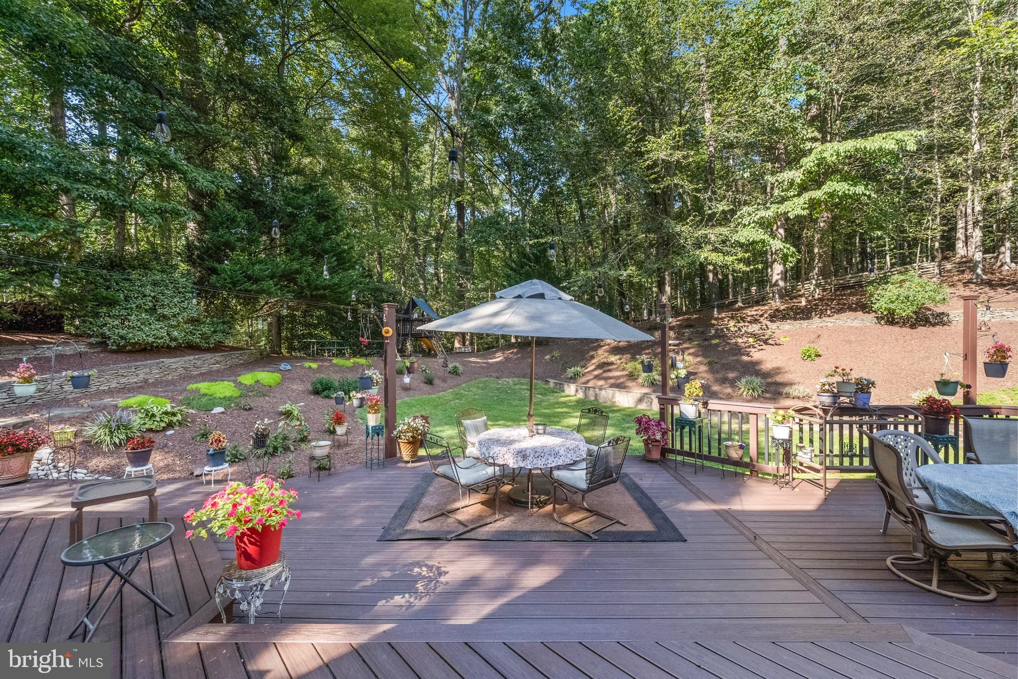 6601 Colchester Road Fairfax Station, VA 22039 - Photo 65 of 78 an outdoor space with furniture and umbrella