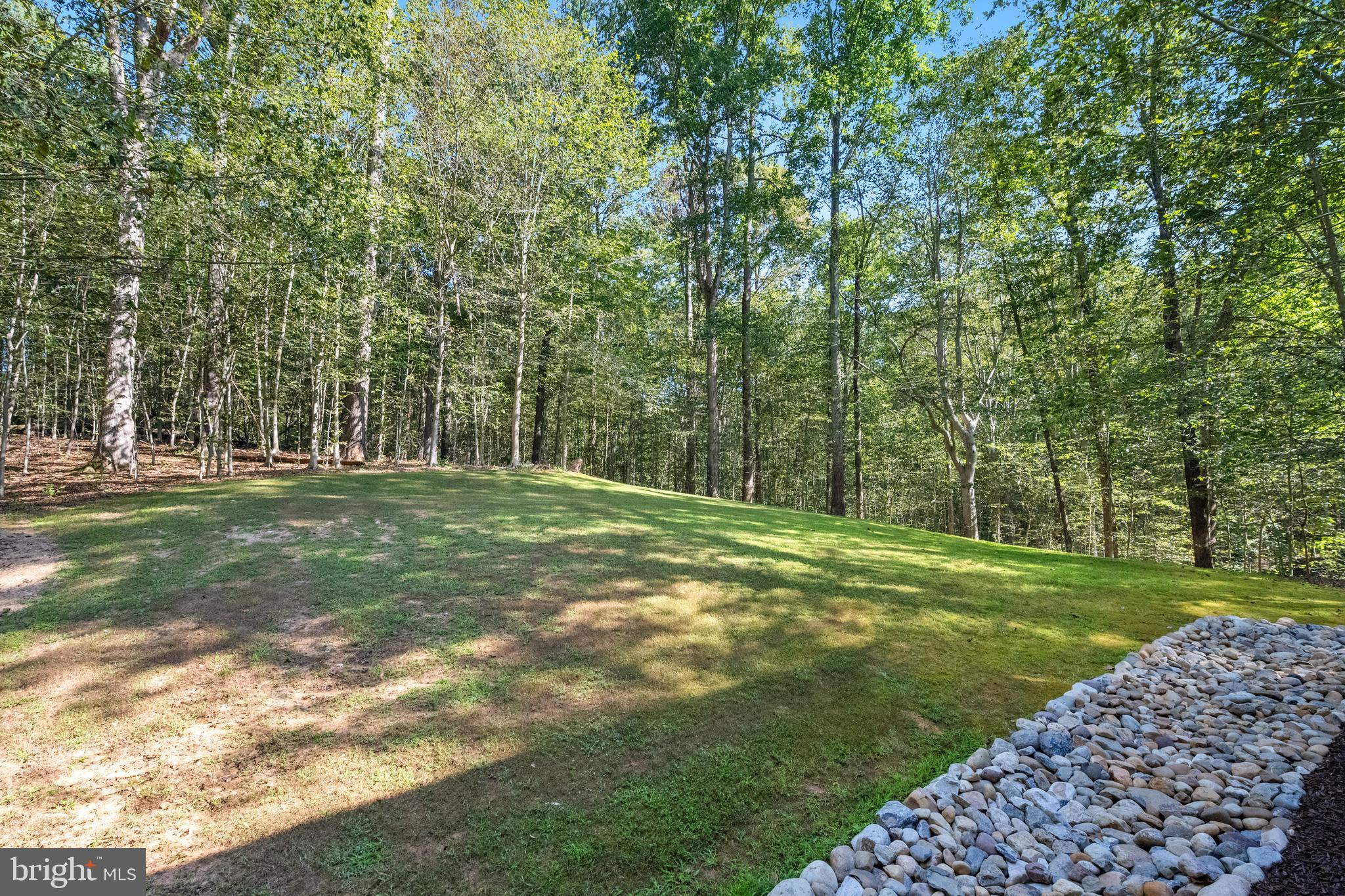 6601 Colchester Road Fairfax Station, VA 22039 - Photo 68 of 78 a view of a grassy field with trees