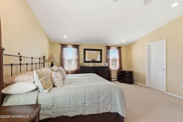 a bedroom with a large bed and a table