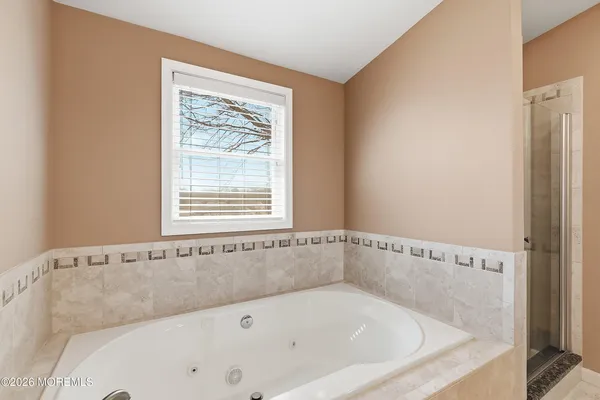 a white bath tub sitting in a bathroom