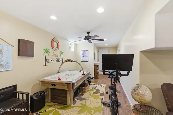 a bedroom with furniture and a flat screen tv
