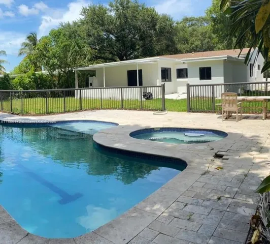 a view of a house with swimming pool