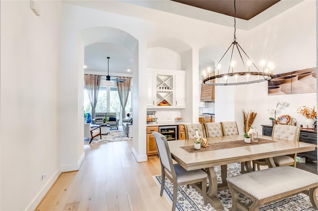 126 LITTLE Strm Cove Austin, TX 78737 - Photo 40 of 40 An open floorplan seamlessly connects the elegant dining area with a convenient dry bar.