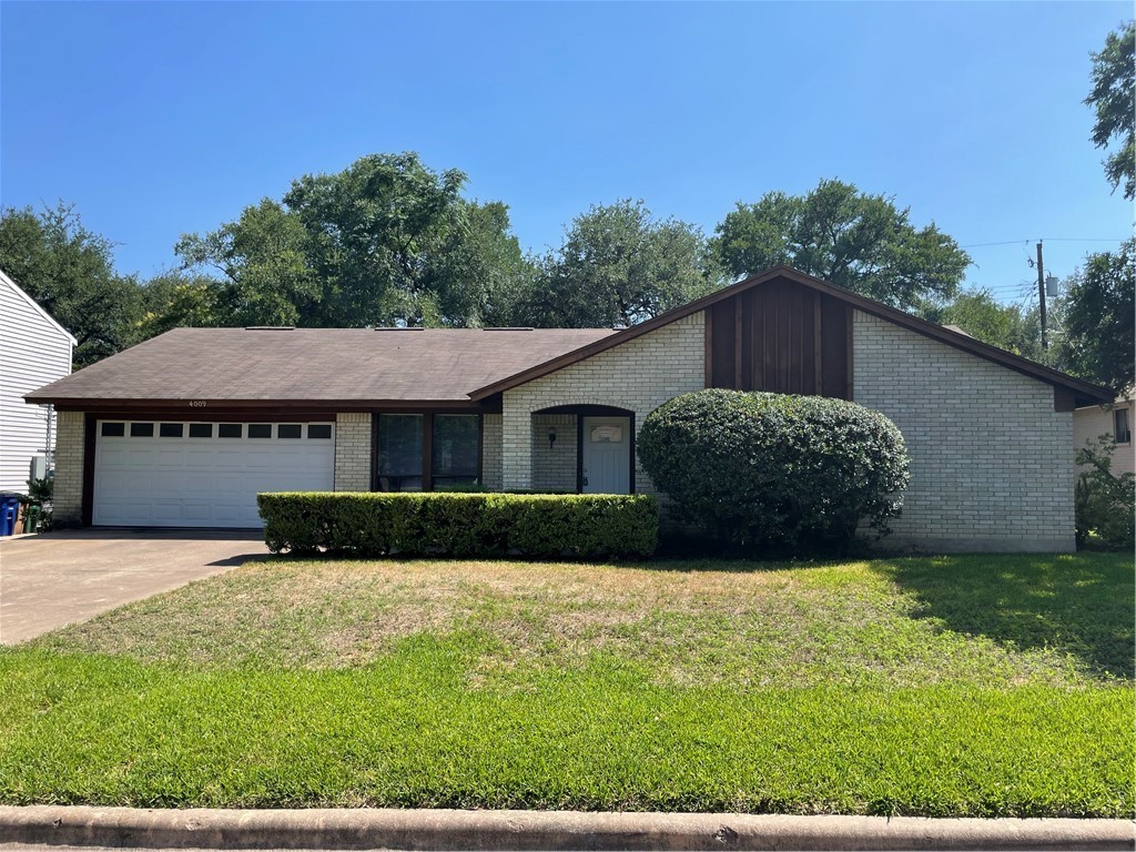 4009 Biscay Drive Austin, TX 78759 - Photo 1 of 1 a view of a house with a yard