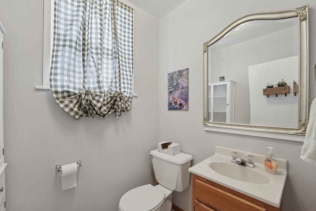 802 3rd Avenue East Ashland, WI 54806 - Photo 13 of 22 Bathroom featuring vanity and toilet