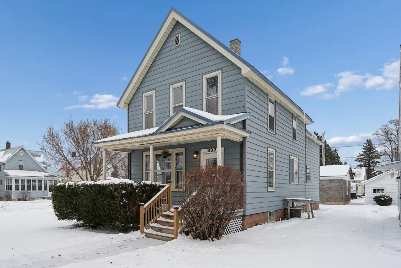 802 3rd Avenue East Ashland, WI 54806 - Photo 2 of 22 View of front of property featuring a porch and a chimney