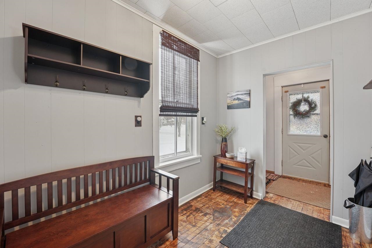 802 3rd Avenue East Ashland, WI 54806 - Photo 3 of 22 Mudroom featuring ornamental molding and plenty of natural light