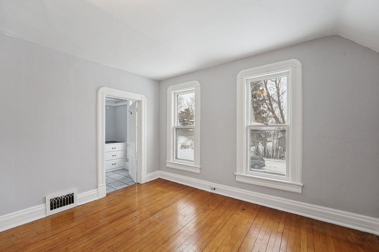 802 3rd Avenue East Ashland, WI 54806 - Photo 10 of 22 Unfurnished room with wood-type flooring and baseboards