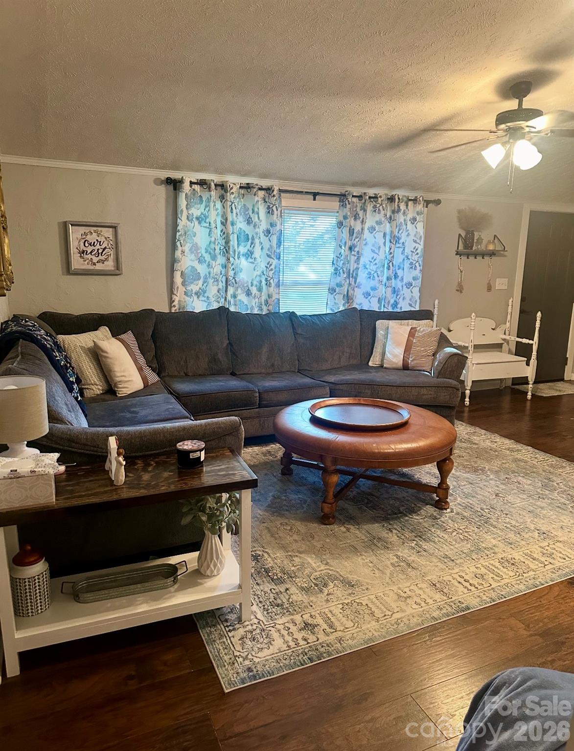5425 Old Creek Road Morganton, NC 28655 - Photo 13 of 22 a living room with furniture a rug and a floor to ceiling window