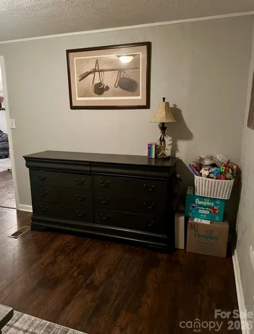 a room with furniture and wooden floor