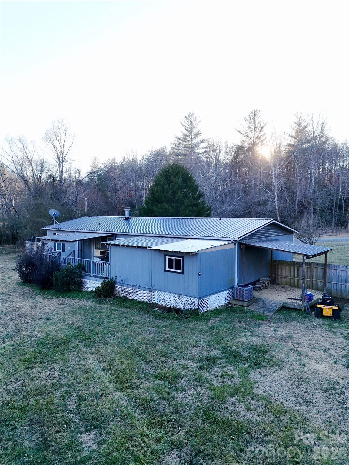 5425 Old Creek Road Morganton, NC 28655 - Photo 17 of 22 a view of a house with a yard and sitting area