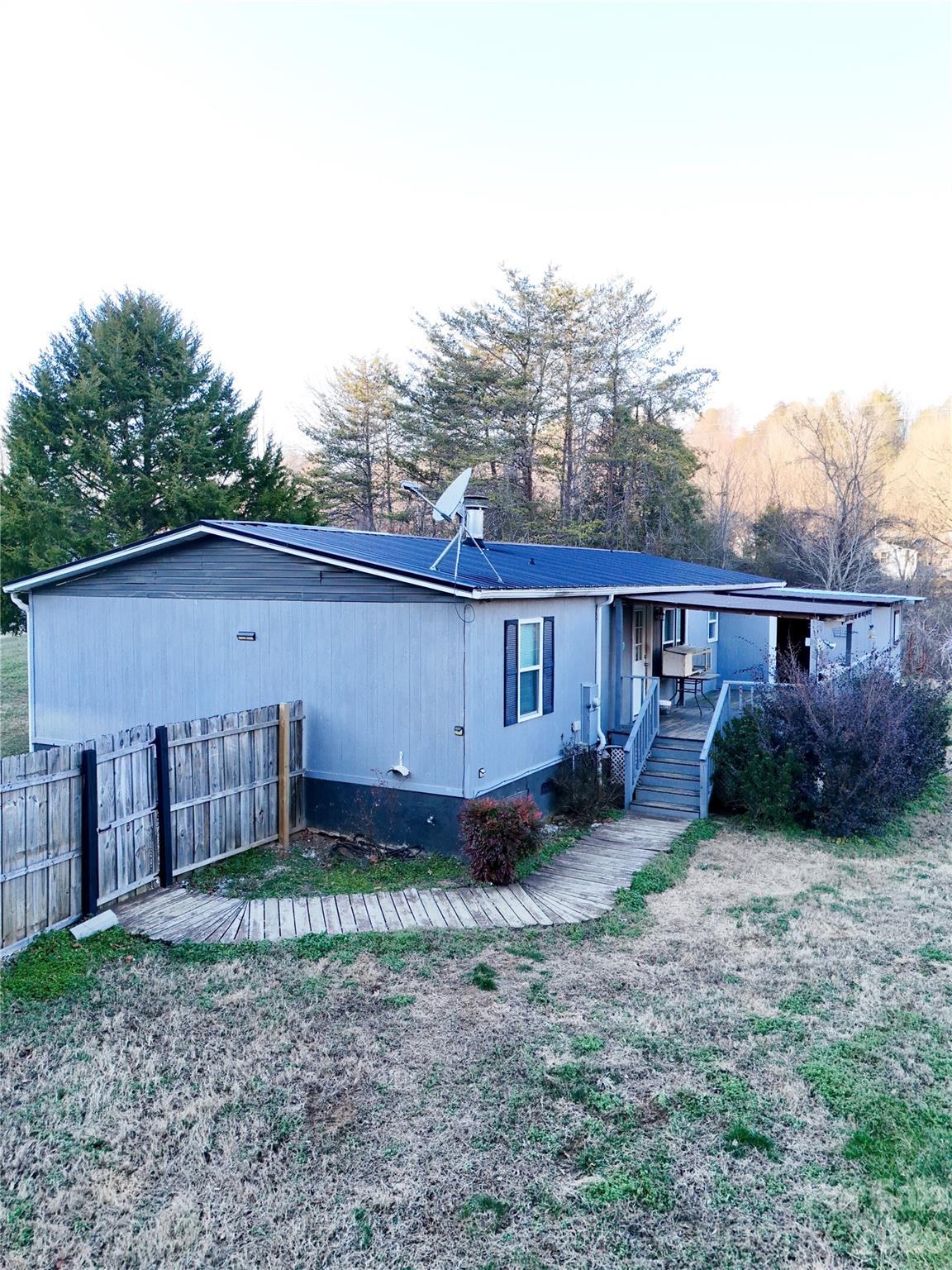 5425 Old Creek Road Morganton, NC 28655 - Photo 18 of 22 a view of a house with a yard and roof