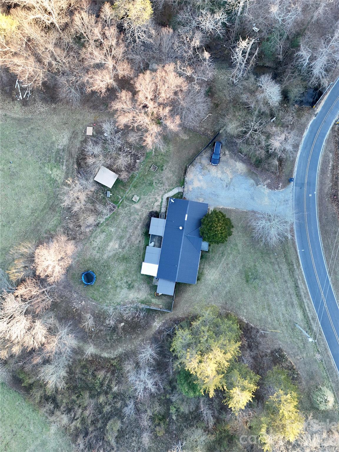 5425 Old Creek Road Morganton, NC 28655 - Photo 20 of 22 a view of a wooden wall with some trees