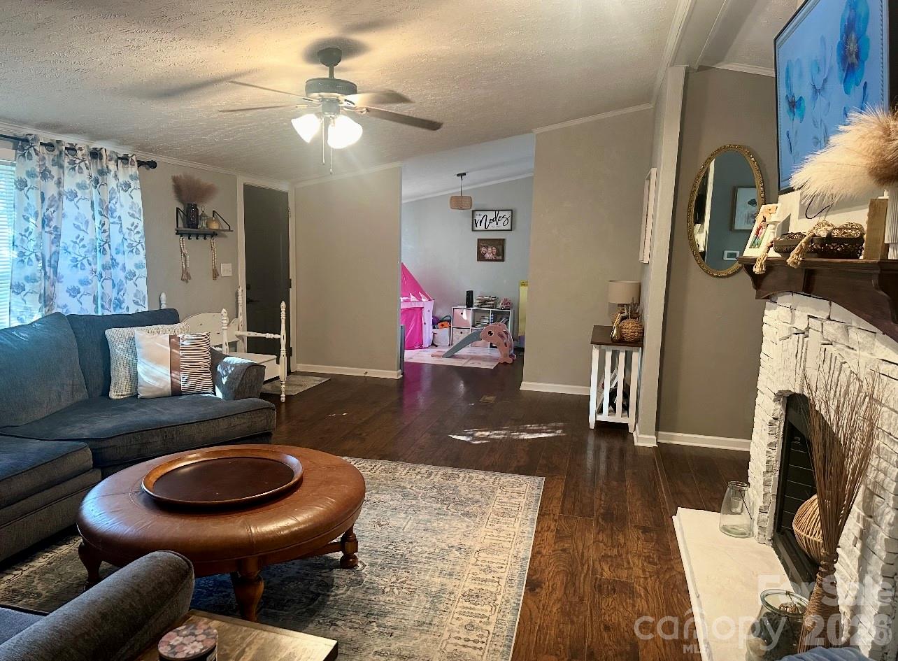 5425 Old Creek Road Morganton, NC 28655 - Photo 6 of 22 a living room with furniture and a fireplace
