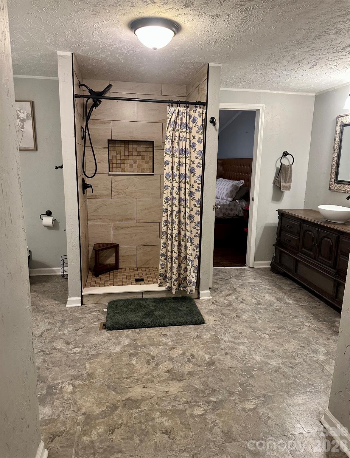 5425 Old Creek Road Morganton, NC 28655 - Photo 8 of 22 a bathroom with a shower and a sink