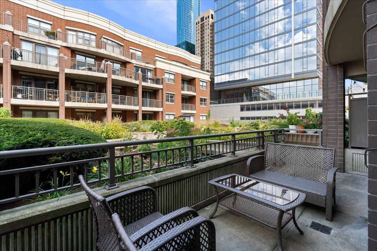 1155 South State Street, Unit 401 Chicago, IL 60605 - Photo 17 of 23 a balcony with furniture and outdoor view