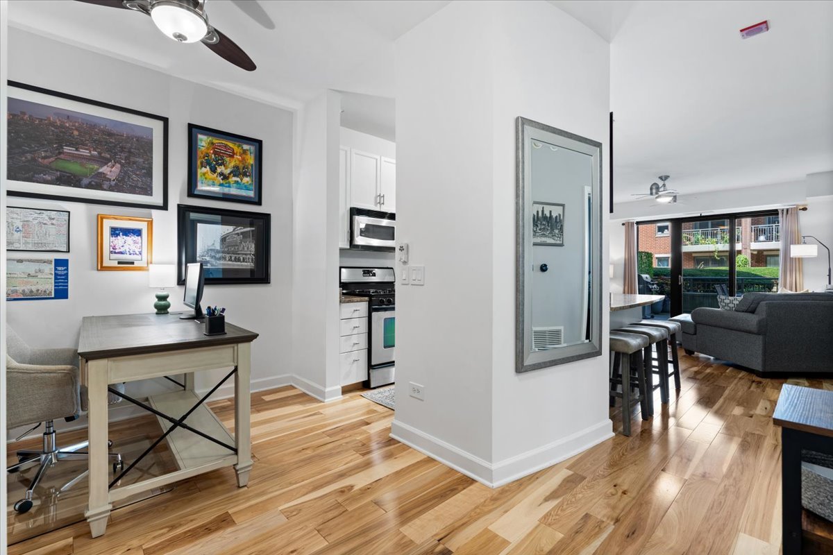 1155 South State Street, Unit 401 Chicago, IL 60605 - Photo 2 of 23 a view of a livingroom with furniture and wooden floor