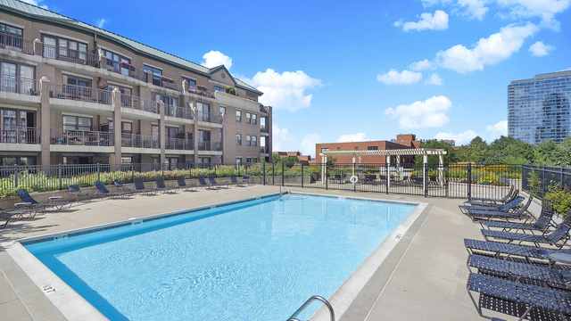 1155 South State Street, Unit 401 Chicago, IL 60605 - Photo 23 of 23 a swimming pool with outdoor seating and yard