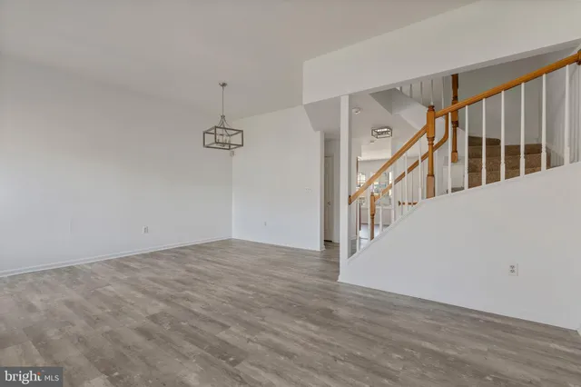 a view of an entryway with wooden floor