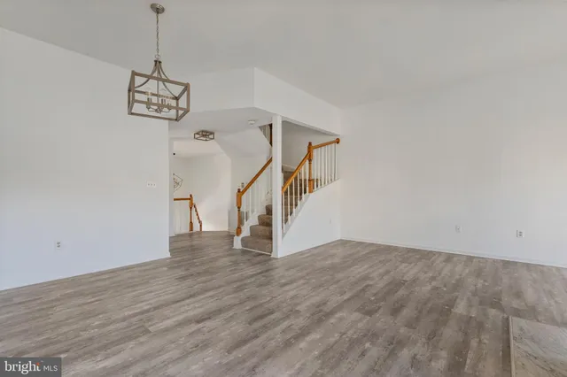 a view of an entryway with wooden floor