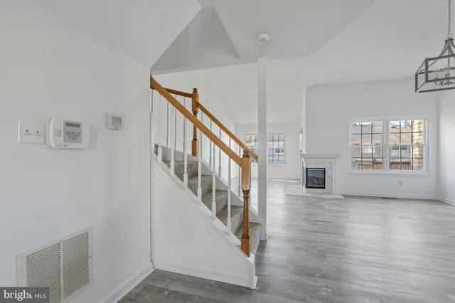 a view of an entryway with wooden floor