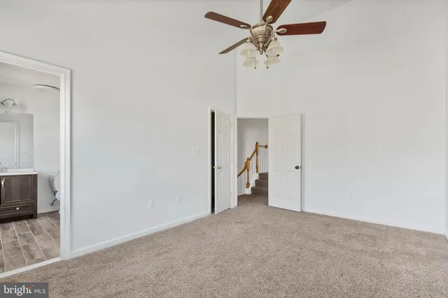 a view of a livingroom with a ceiling fan and a ceiling fan