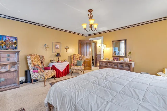 a bedroom with a bed and ceiling fan