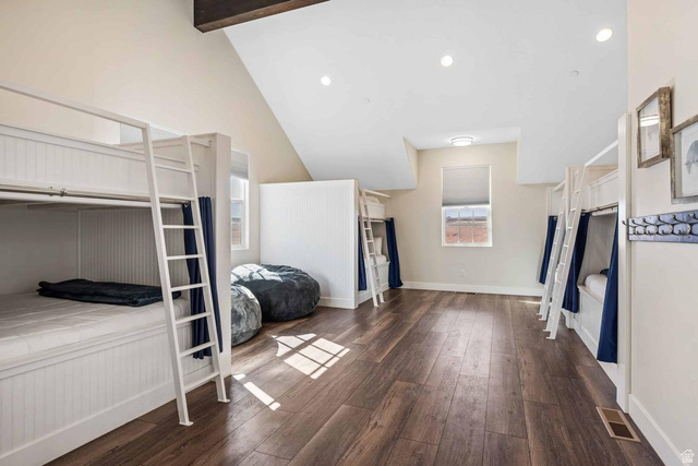 4311 Canterbury Road, Unit F2 Hurricane, UT 84737 - Photo 12 of 18 Spacious room featuring multiple built-in bunk beds with individual privacy curtains, wood-finish flooring, recessed lighting, and an exposed ceiling beam