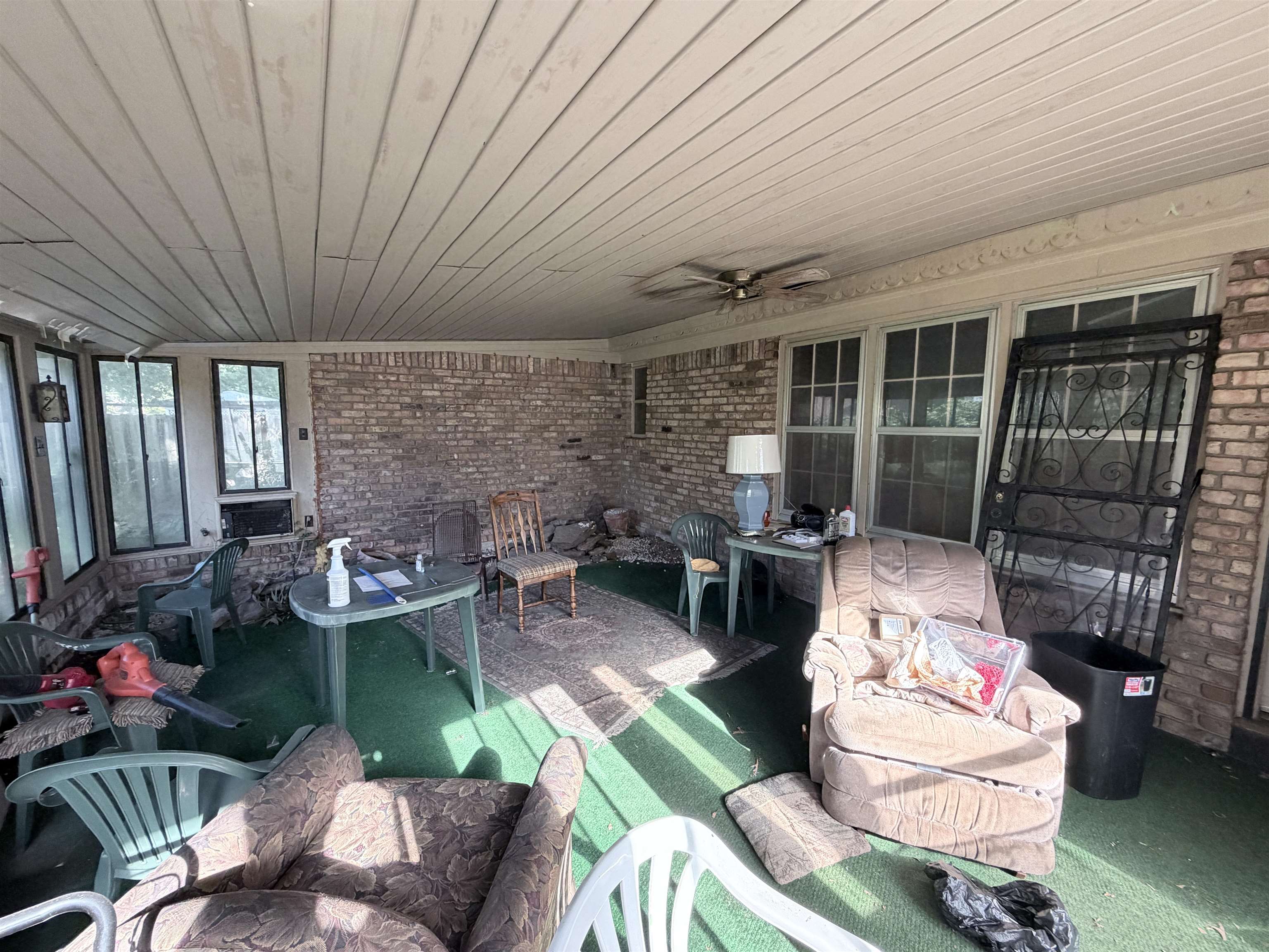 5536 Cottonwood Road Memphis, TN 38115 - Photo 8 of 28 Covered patio with a paneled ceiling, brick walls, and multiple windows