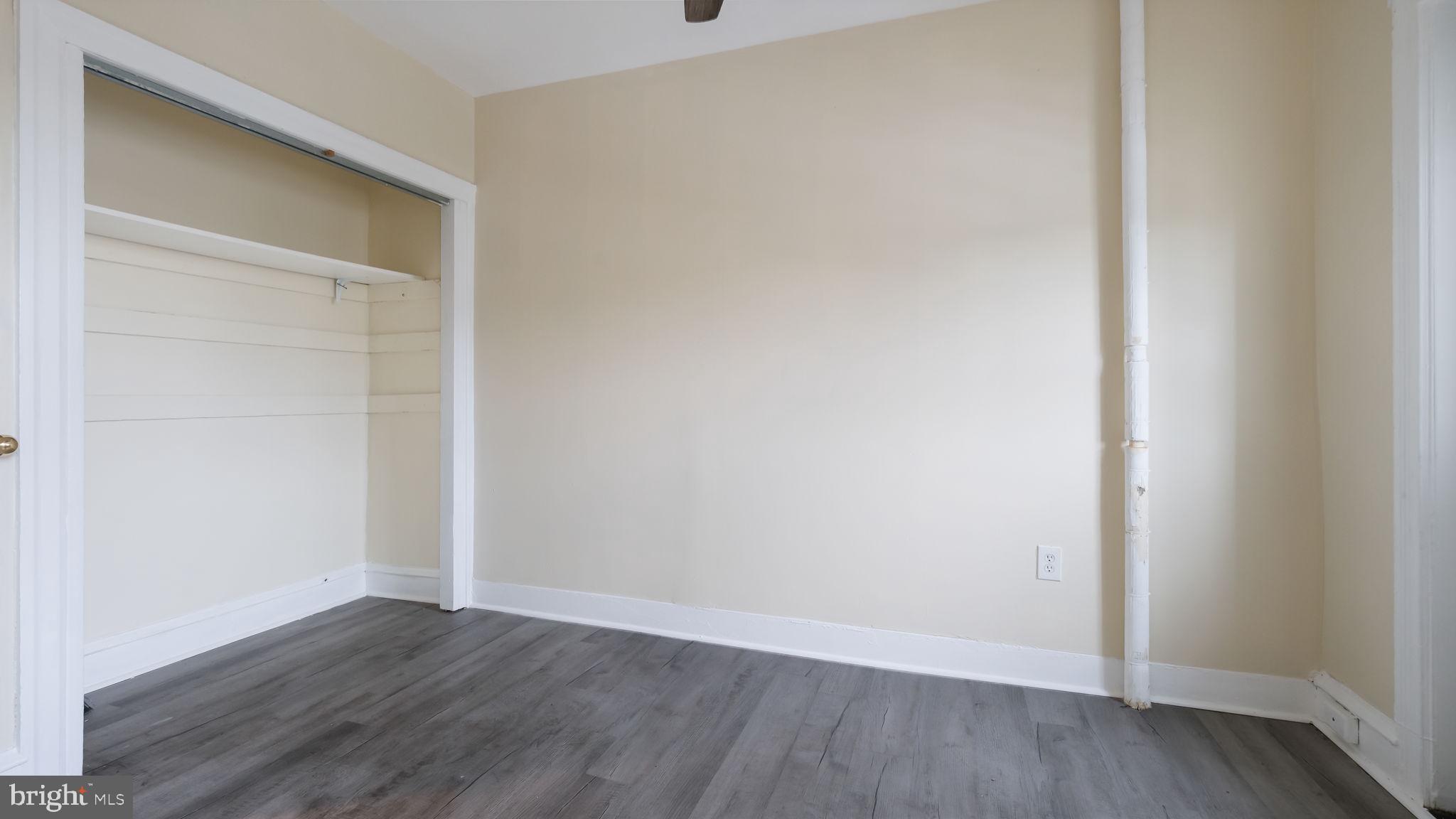 2 West State Street, Unit 2A Media, PA 19063 - Photo 9 of 12 a view of an empty room with wooden floor