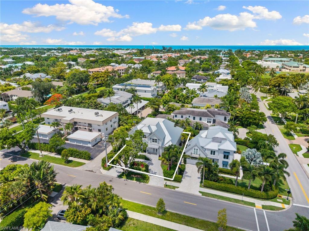 950 8th Street South Naples, FL 34102 - Photo 20 of 21 an aerial view of residential houses with outdoor space and ocean view