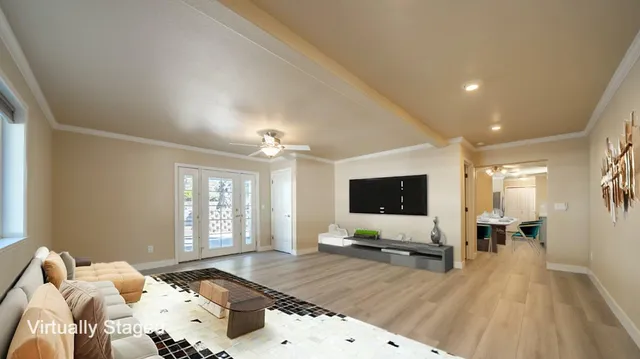 a bedroom with a large bed and a chandelier