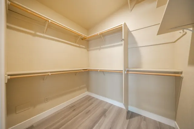 a bedroom with a bed and a desk