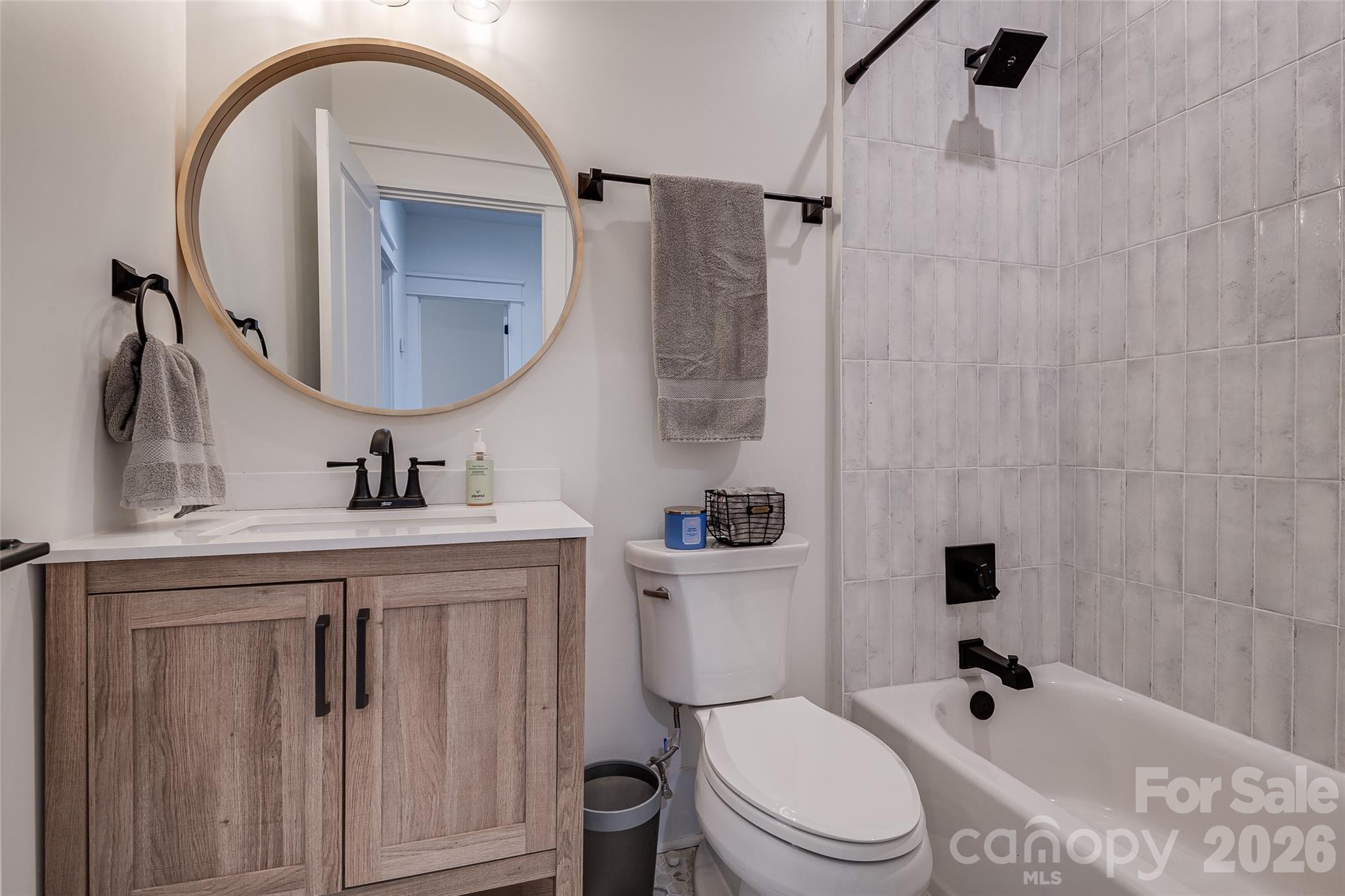 1516 Princess Place Charlotte, NC 28208 - Photo 35 of 46 a bathroom with a sink a toilet and a mirror