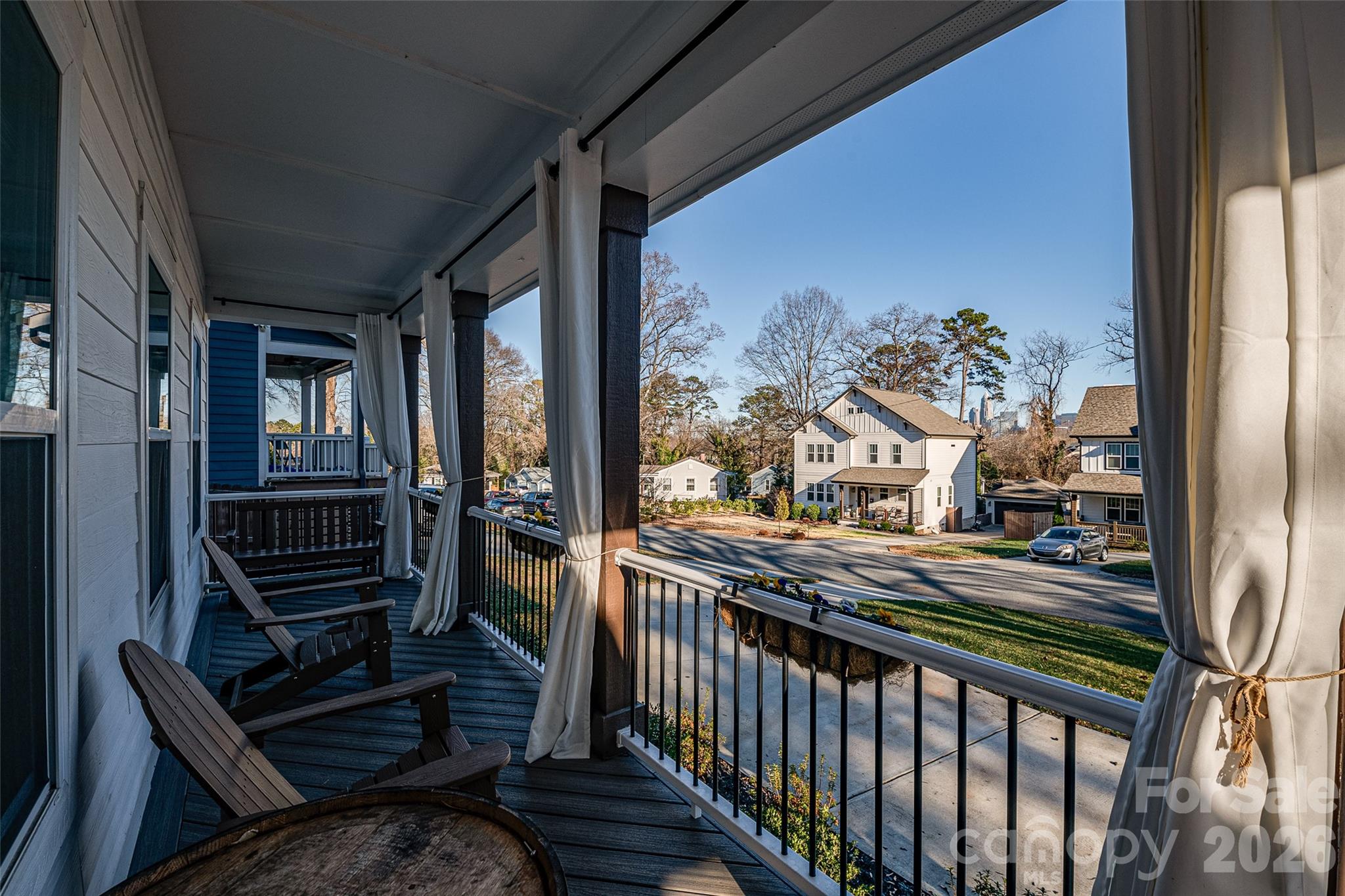 1516 Princess Place Charlotte, NC 28208 - Photo 5 of 46 a view of a porch with wooden floor and furniture