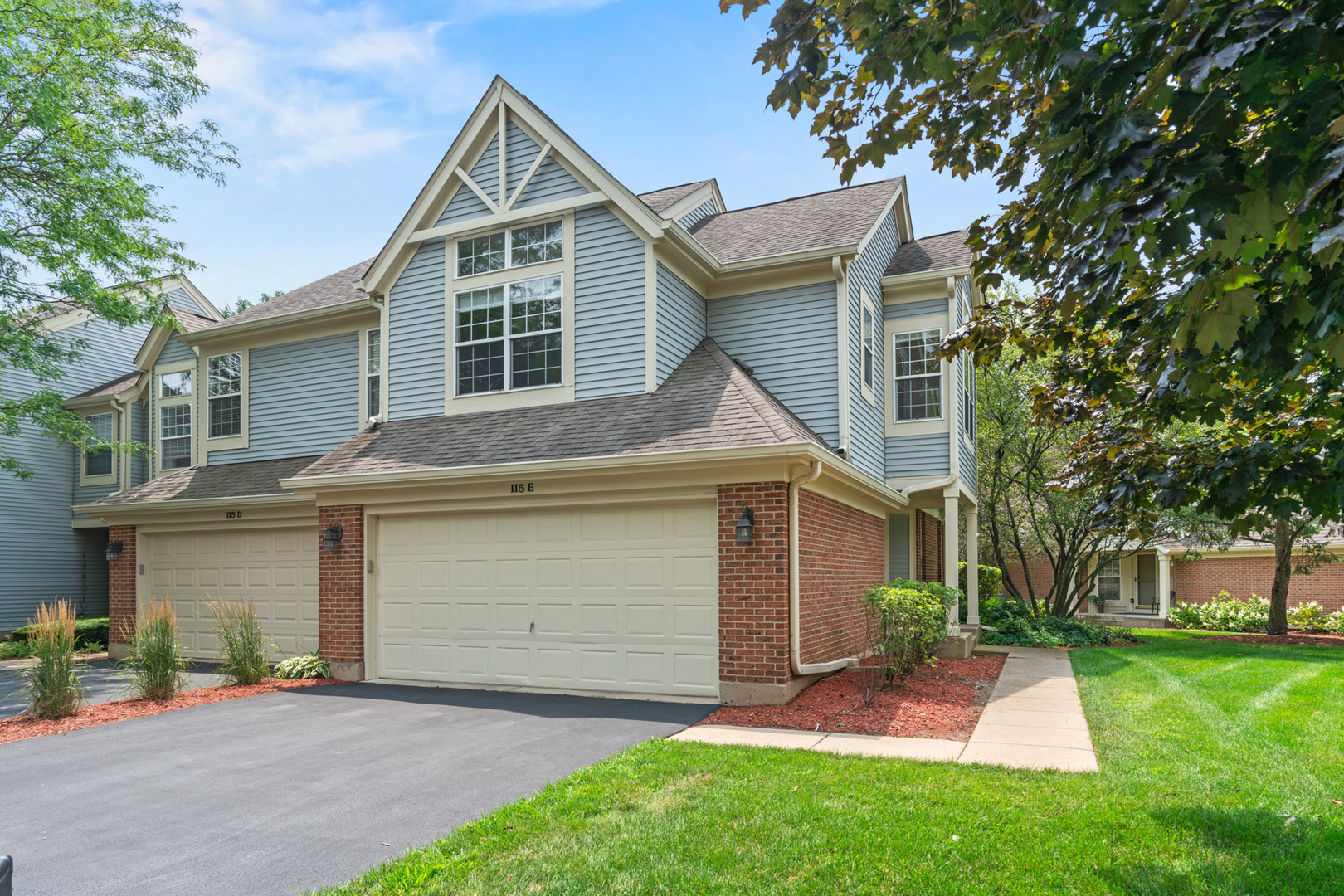 front view of a house with a yard