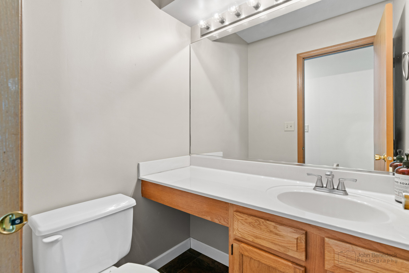 115 Ione Drive, Unit E South Elgin, IL 60177 - Photo 11 of 29 a bathroom with a sink a toilet and vanity