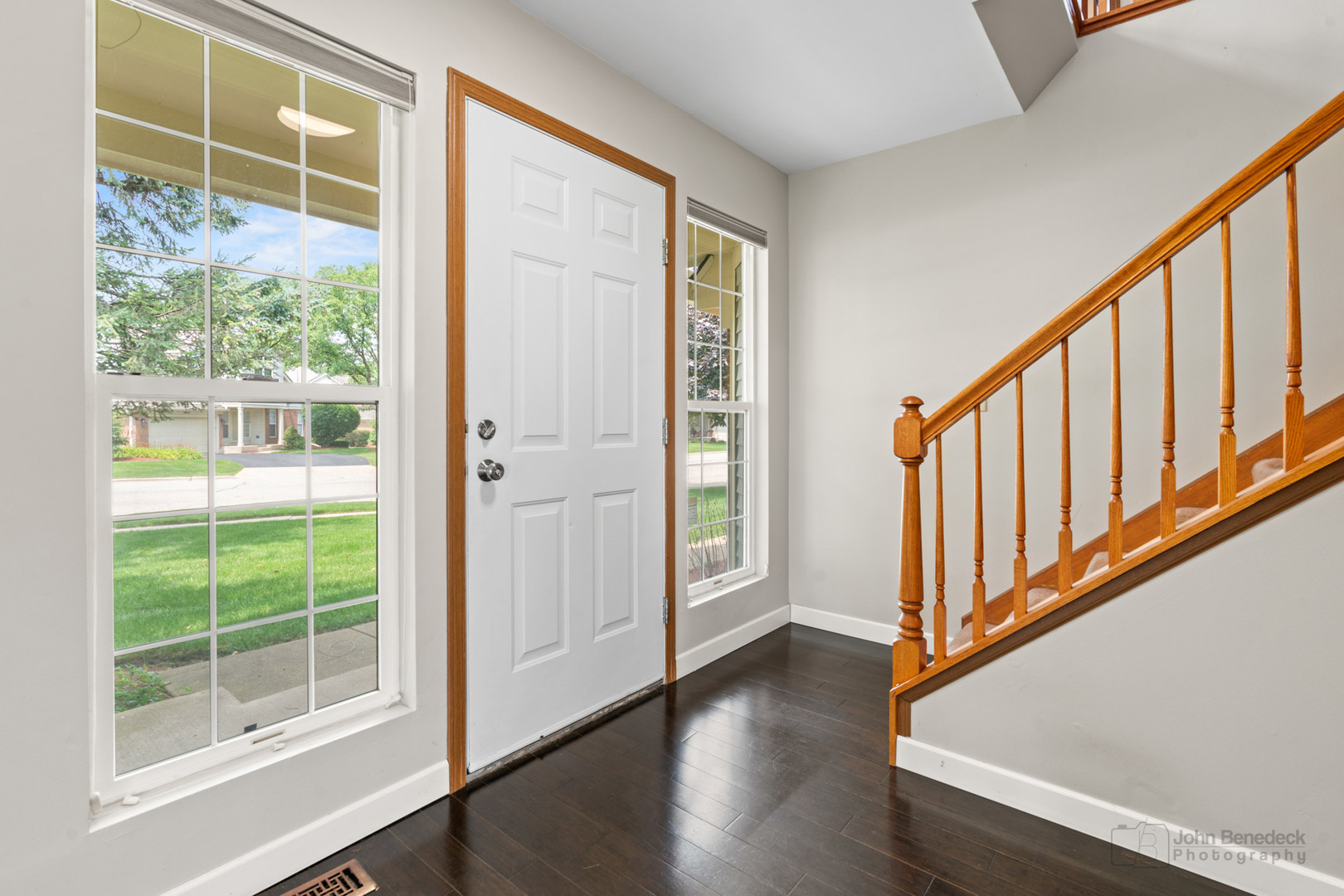 115 Ione Drive, Unit E South Elgin, IL 60177 - Photo 12 of 29 a view of an entryway with wooden floor and windows