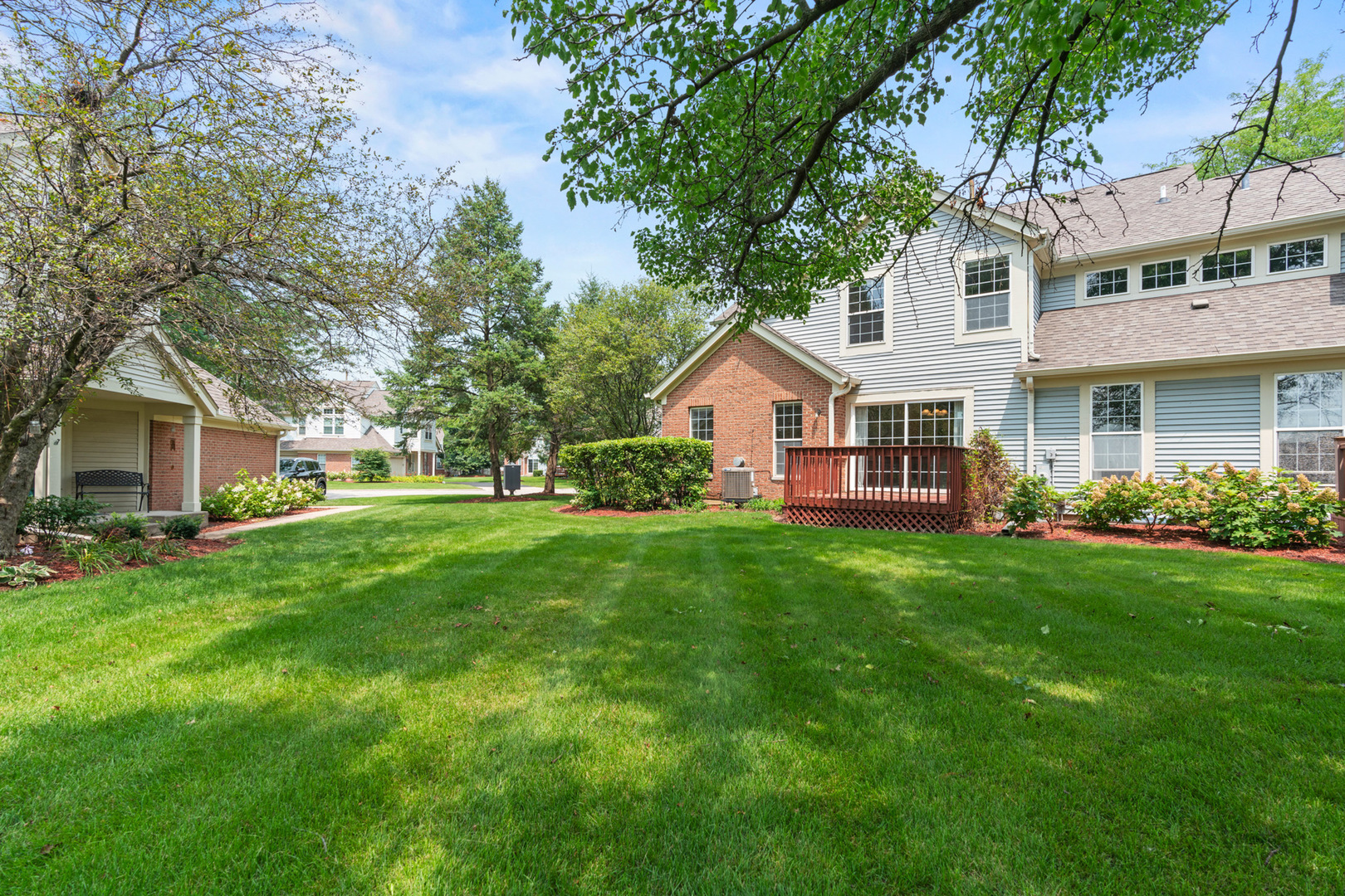 115 Ione Drive, Unit E South Elgin, IL 60177 - Photo 23 of 29 a view of house with yard and green space