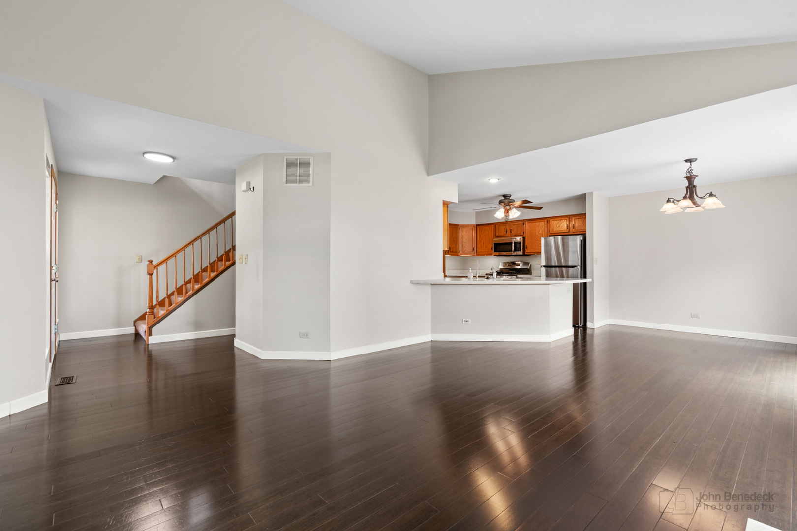 115 Ione Drive, Unit E South Elgin, IL 60177 - Photo 4 of 29 a view interior of a house and kitchen view with wooden floor