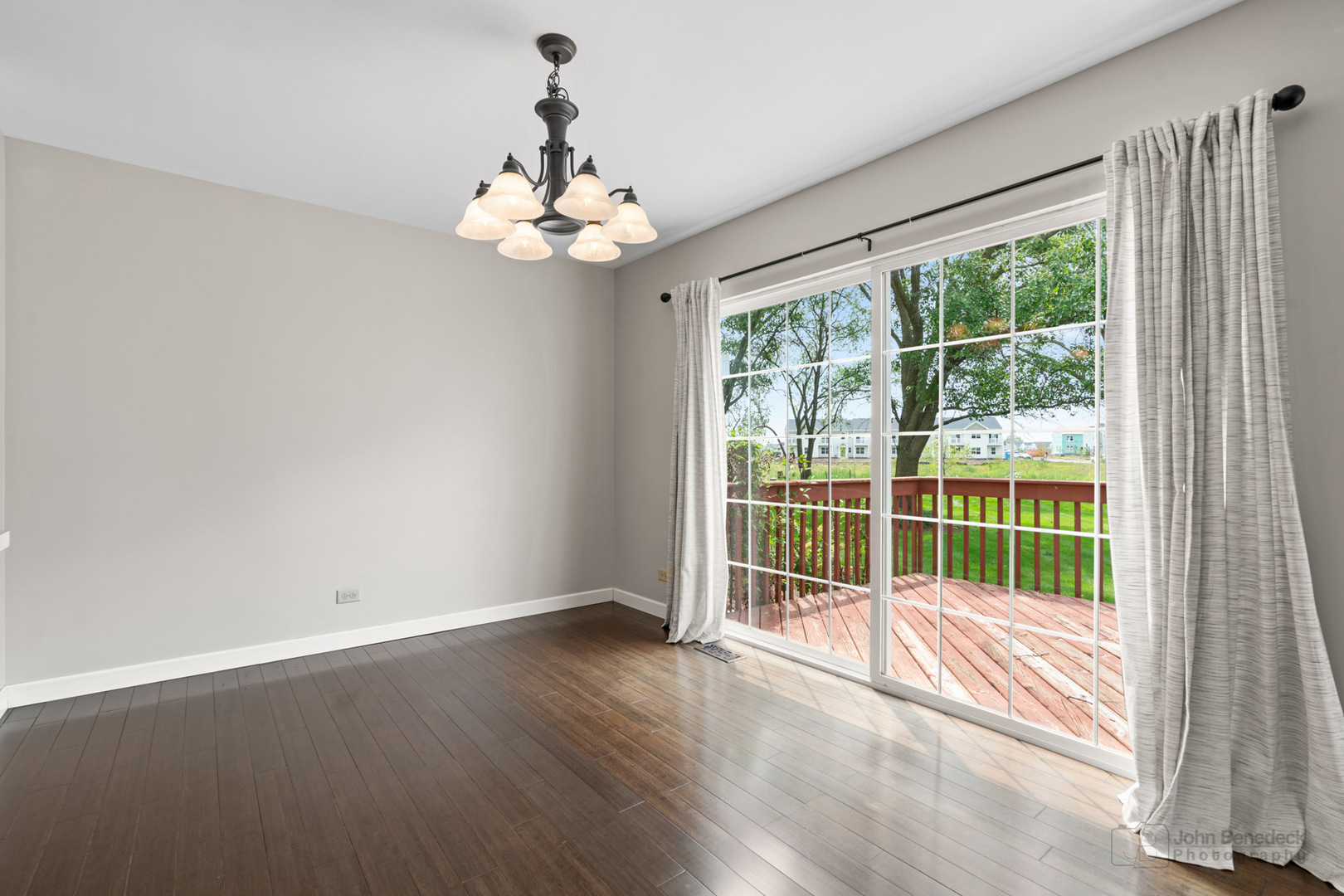 115 Ione Drive, Unit E South Elgin, IL 60177 - Photo 5 of 29 a view of a room with wooden floor and large windows