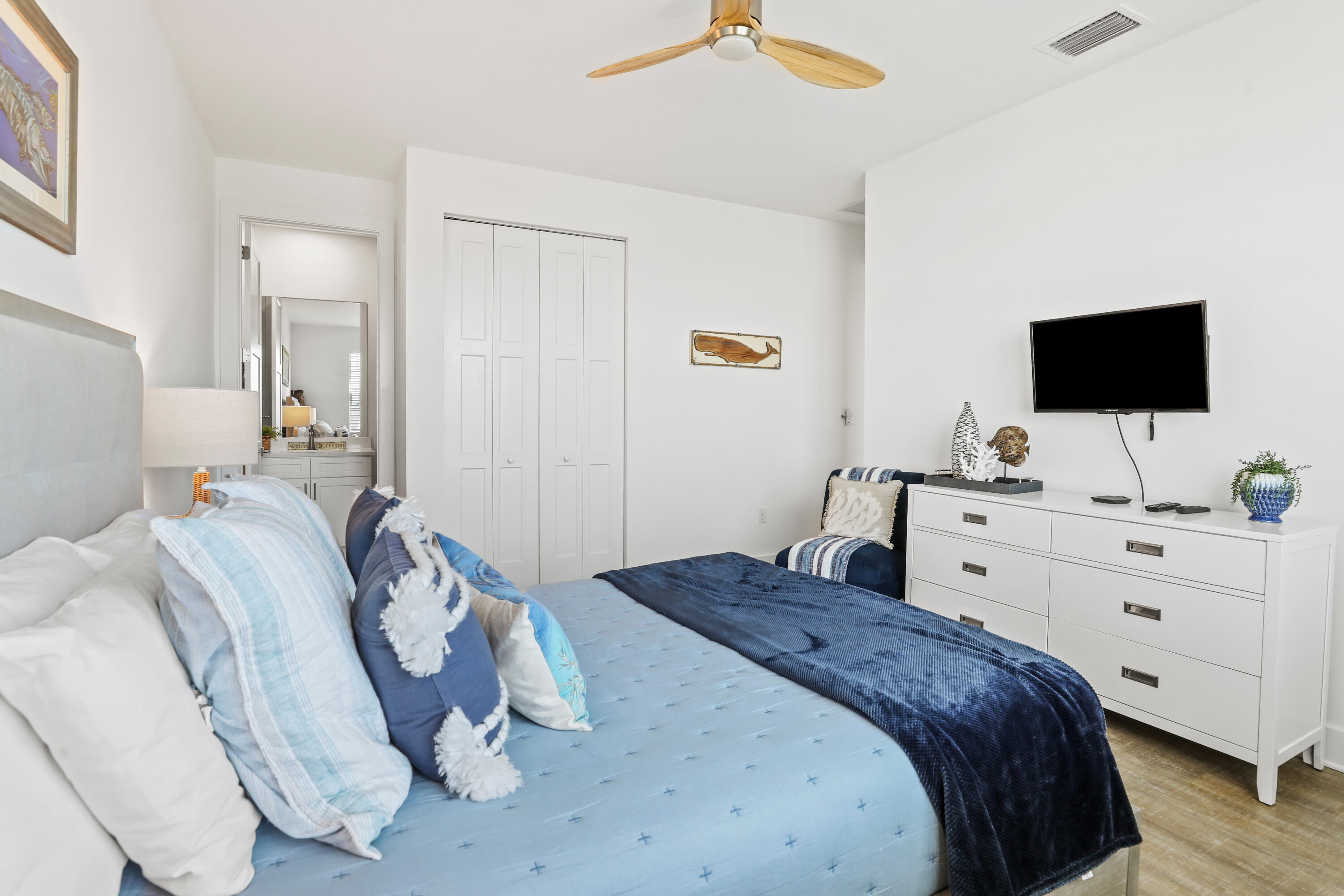 1140 92nd Street Marathon, FL 33050 - Photo 17 of 32 a bedroom with a bed and a flat screen tv