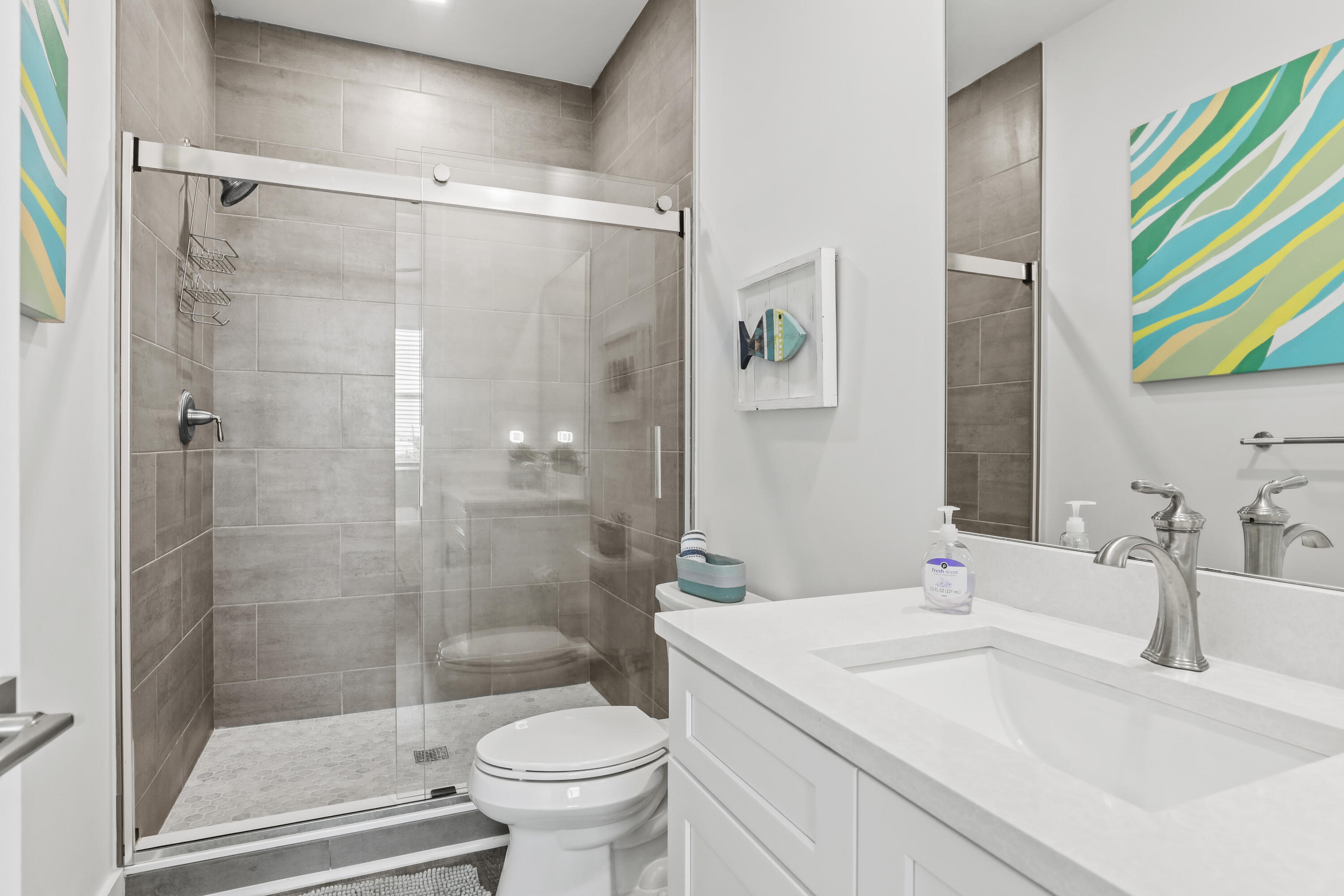 1140 92nd Street Marathon, FL 33050 - Photo 19 of 32 a bathroom with a sink and a mirror