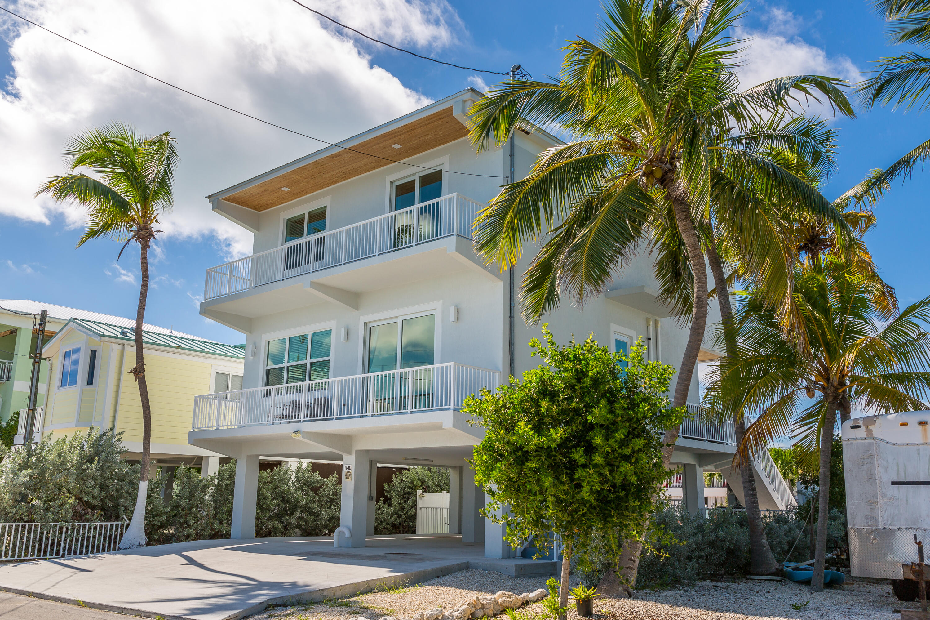 1140 92nd Street Marathon, FL 33050 - Photo 29 of 32 a front view of a house with garden