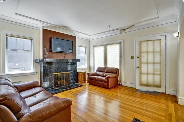 a living room with furniture flat screen tv and a fireplace
