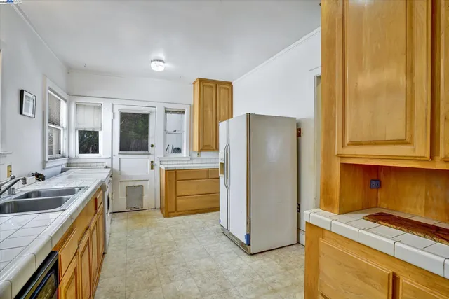 a kitchen with a stove and a refrigerator