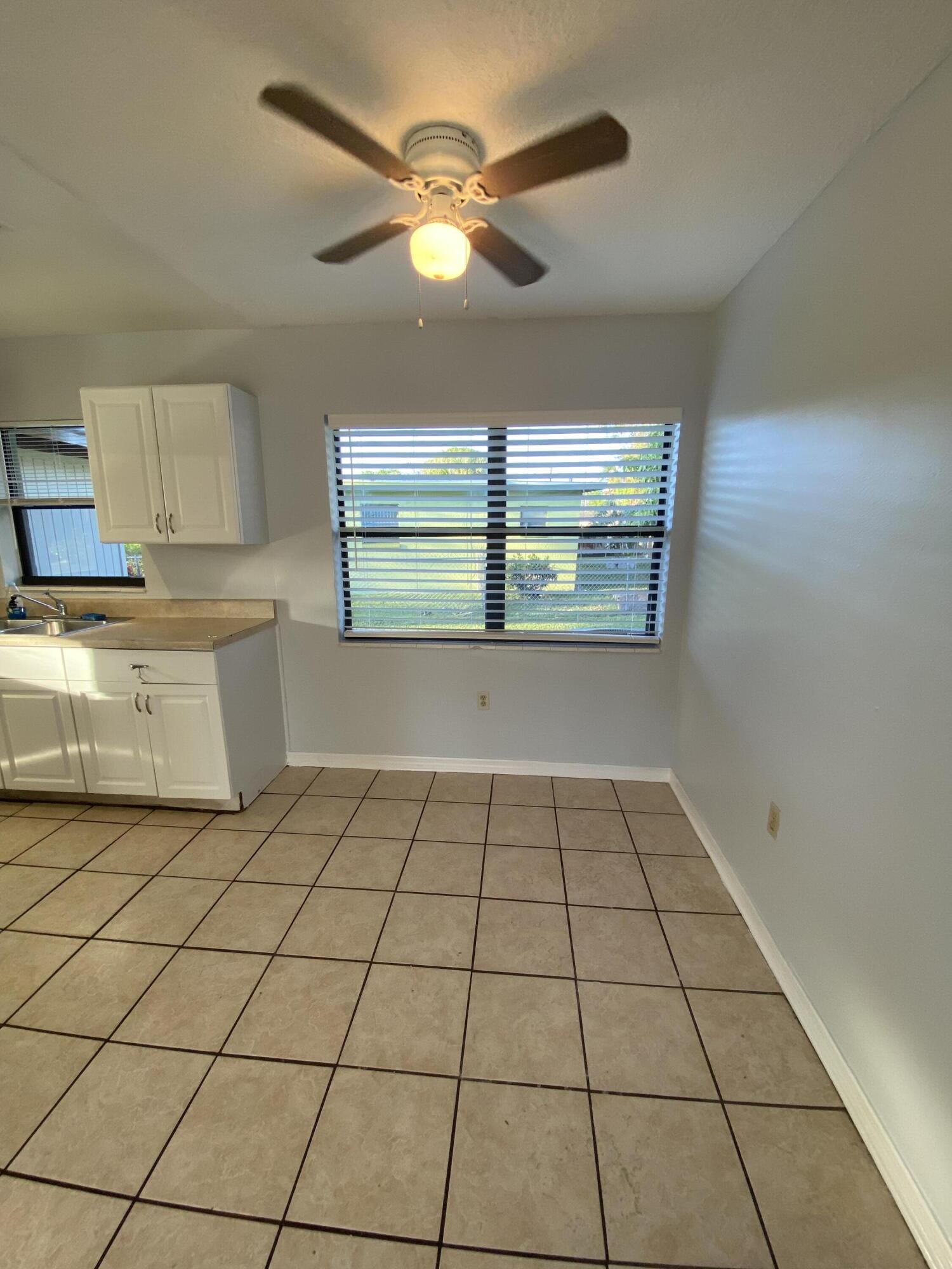 118 Explorer Street Cocoa, FL 32922 - Photo 15 of 19 a view of a kitchen with a sink and a window